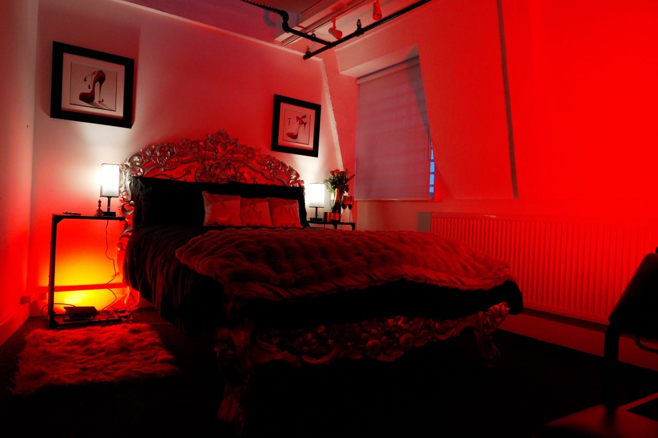 Aftercare bedroom with an ornate double bed and bedside lamps